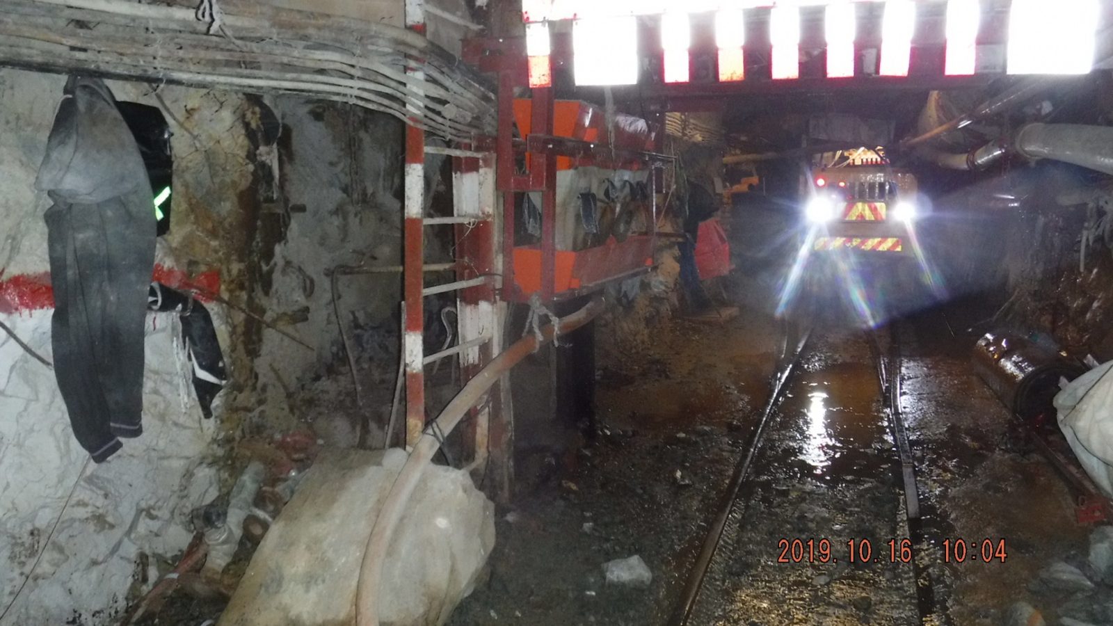 Row of Mud Accumulators keeping a cross cut and tramming track clear of mud and fines