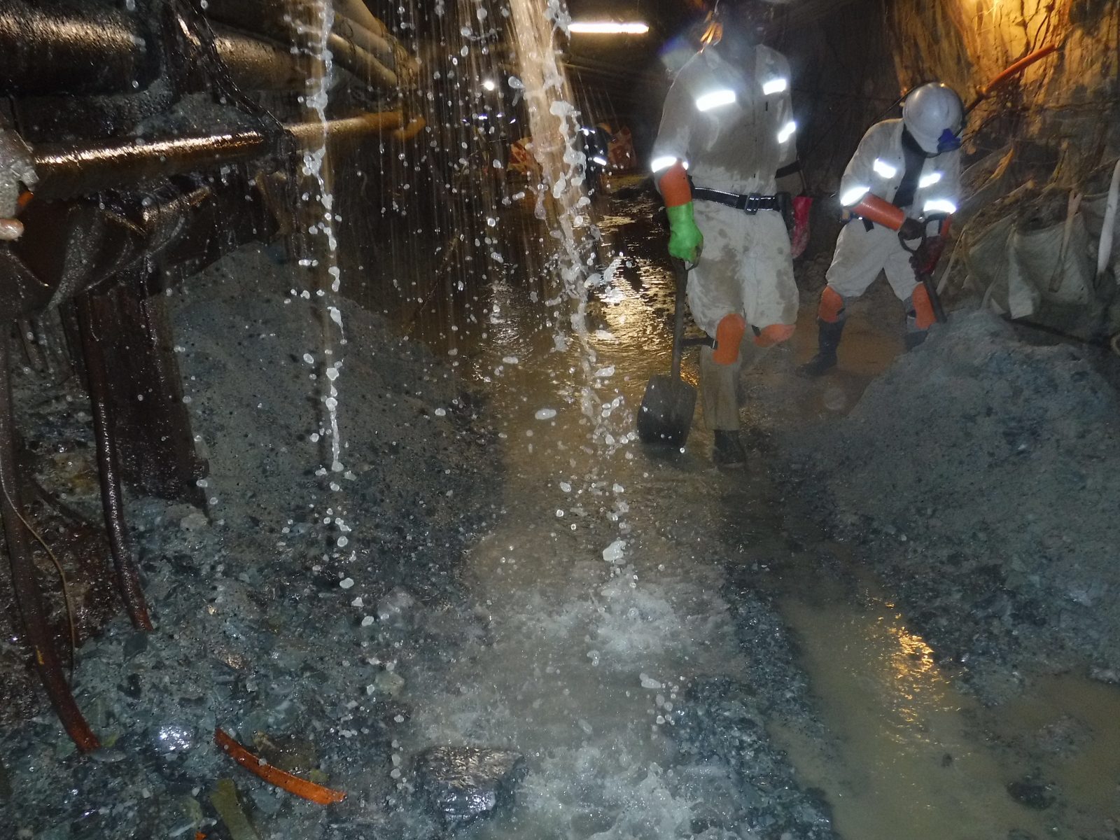 Track being graded and re-aligned in an underground cross cut